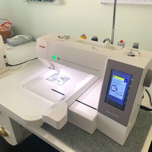 Janome 550e Embroidery Machine--Plus many extras--58 spools Glide Thread